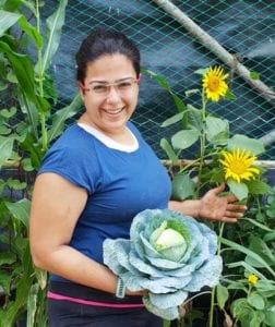 Diipti Jhangiani Founder of Edible Gardens showing the cabbage produce grown at her Urban Farming Space